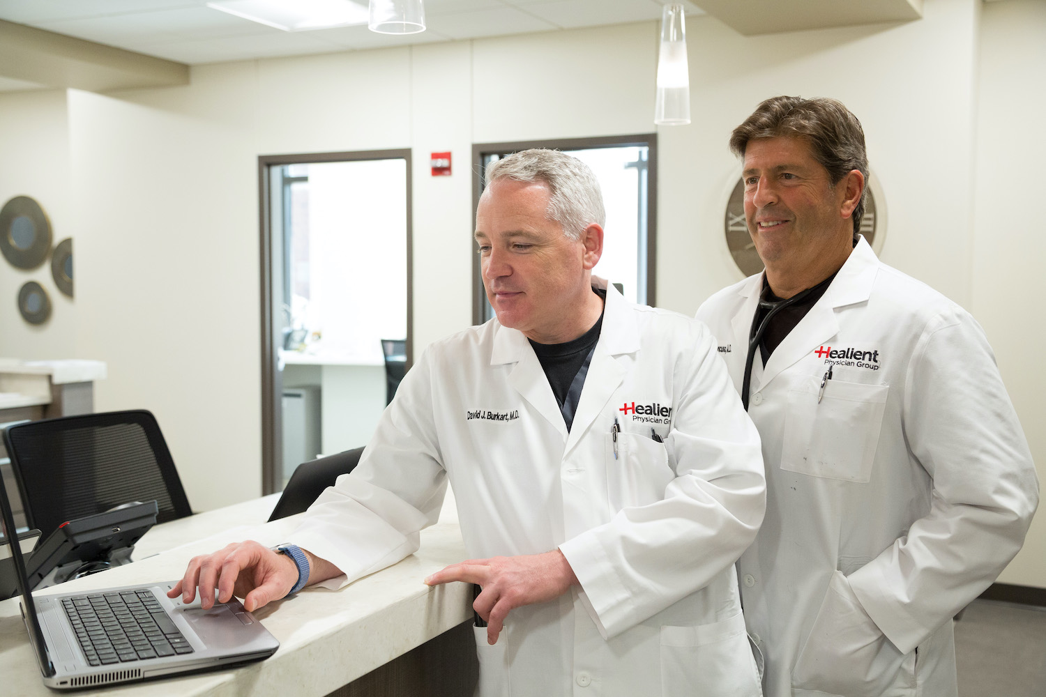 Healient Doctors discussing a patient over a laptop